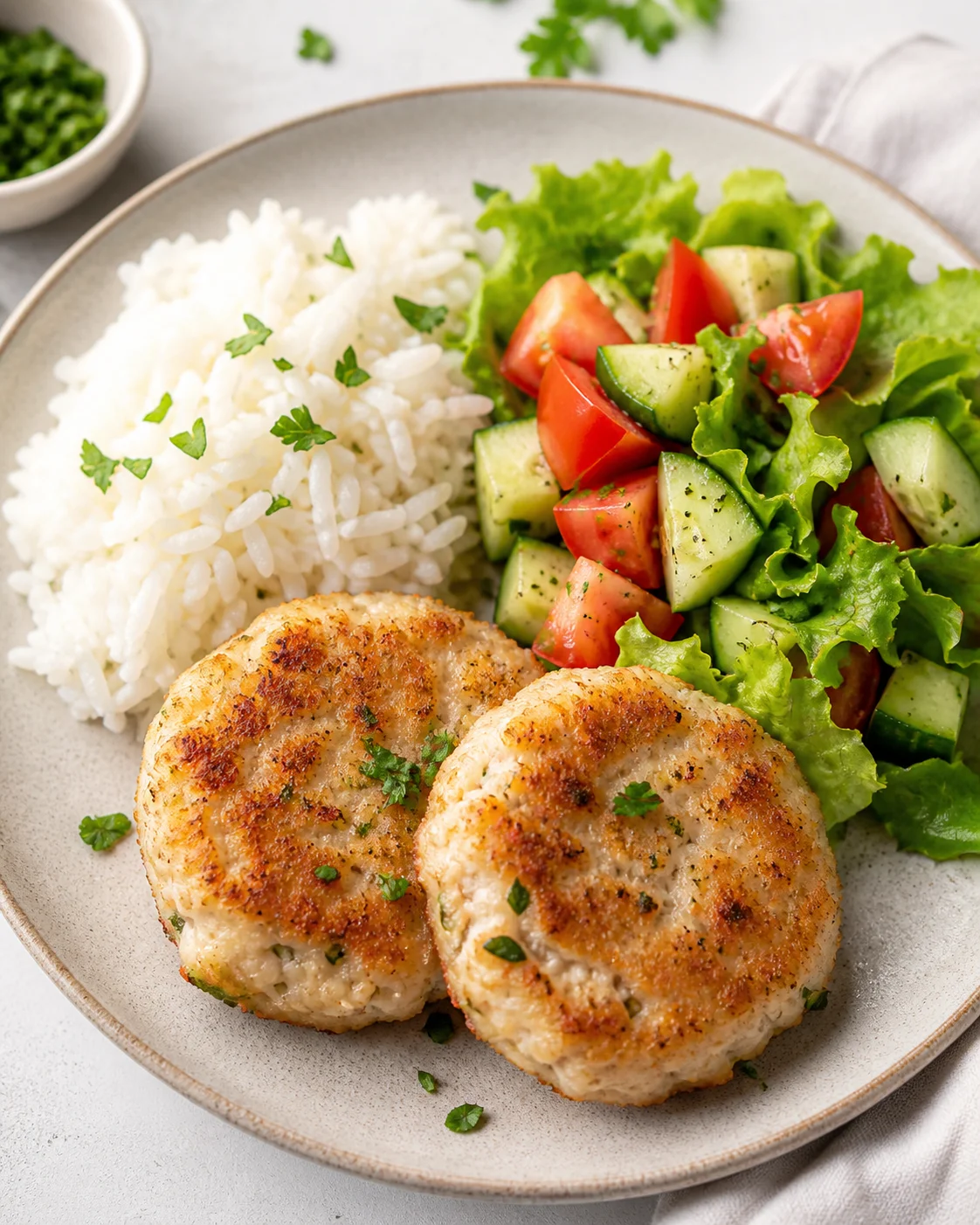 Fish patties with rice and salad